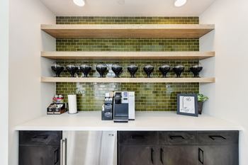 Coffee Bar, Cream Packets, Cabinets, and Abstract Drawing in Photo Frame